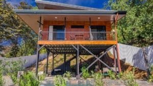 Modern elevated home in Dominical with spacious deck and lush surroundings.