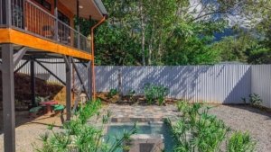 Beautiful garden with plants and a small water feature in Dominical, Costa Rica.