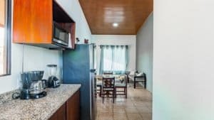 Interior view of a fully equipped kitchen and dining space in Costa Rica.