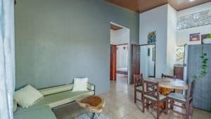 Interior view of a Costa Rican home with dining area and living space.