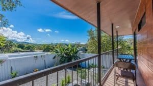 Balcony overlooking lush landscape and distant mountains in Dominical.