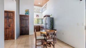 Interior view of a fully equipped Costa Rican home with dining area and kitchen.