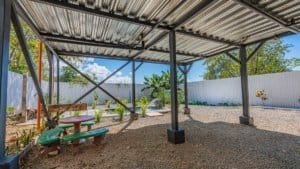 Covered outdoor patio with seating and garden in Dominical Costa Rica.