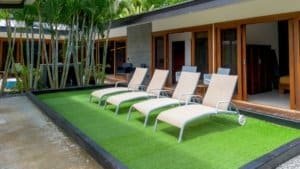 Modern Costa Rican home in Uvita with pool, lounge chairs, and tropical plants.