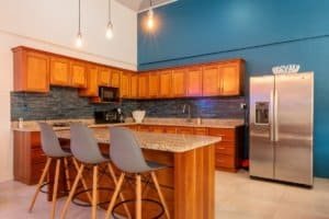 Stylish kitchen with wooden cabinets, granite countertops, and stainless steel appliances.