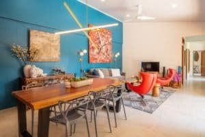 Modern living room in Uvita with colorful art and contemporary furniture.