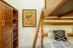Interior of a bedroom with wooden furniture and Costa Rican decor.