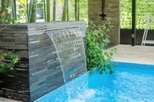 Stylish outdoor pool with waterfall feature near Uvita beach in Costa Rica.