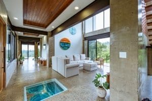 Spacious living room with large windows and ocean view in Dominical.