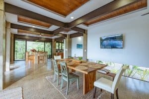 Spacious dining area with ocean view, modern design, and natural light.