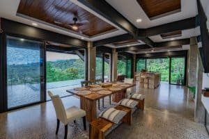 Spacious living and dining area with panoramic ocean views in Dominical.