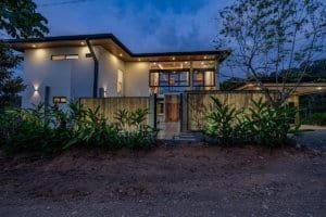 Contemporary house with large glass windows and wooden accents in Dominical.