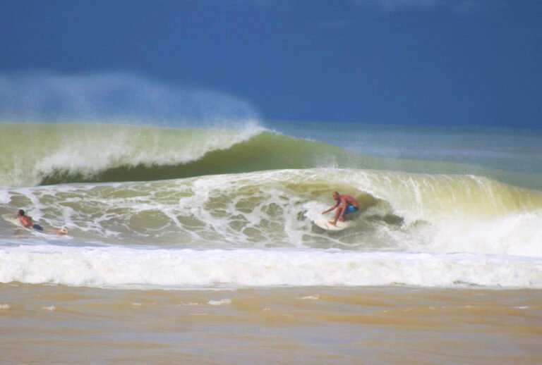 man surfing barrel at dominical beach