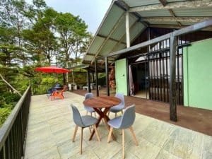 Cabin with ocean and valley view in Dominical Costa Rica, outdoor seating area.