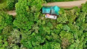 Aerial view of a cabin with ocean and valley views in Dominical, Costa Rica.
