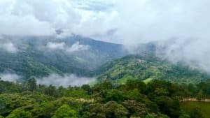 Scenic view of lush green mountains and ocean in Dominical, Costa Rica.