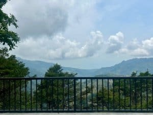 Beautiful mountain landscape with lush greenery and cloudy sky in Dominical.