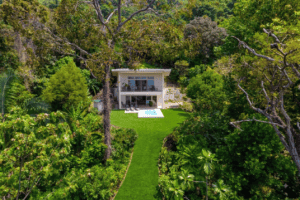 Modern ocean view home surrounded by lush tropical forest in Dominical.