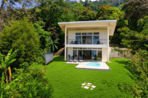 Contemporary 2-story house with ocean view, pool, and lush garden in Dominical.