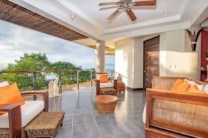 Balinese-style home with ocean view, spacious balcony, and modern decor.