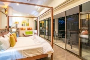 Spacious bedroom with balcony overlooking the ocean in Dominical Costa Rica.