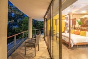 Balinese-style home with ocean view balcony and modern interior.