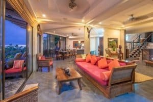 Spacious Balinese-inspired living room with ocean view and elegant decor.