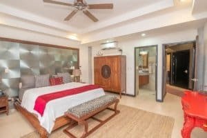 Spacious bedroom with modern decor and ocean view in Dominical Costa Rica.