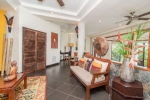 Elegant living room with tropical decor and ocean view in Dominical.