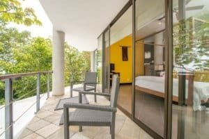 Balinese-style home with ocean view balcony and modern interior.