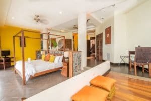Elegant interior of a Balinese-inspired home with ocean view and modern decor.