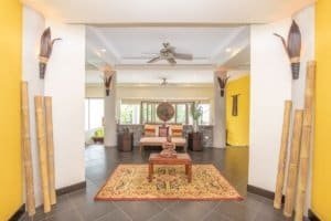 Spacious living room with Balinese decor and ocean view in Dominical.