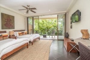 Spacious living room with balcony and ocean view in Dominical, Costa Rica.
