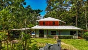 Fully renovated Costa Rican-style home with streams and lush greenery.