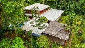 Fully renovated Costa Rican-style home with expansion potential and streams nearby.
