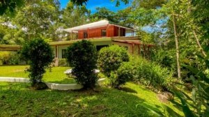 Fully renovated Costa Rican-style home with streams and expansion potential.