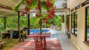 Fully renovated Costa Rican-style home with pool, streams, and lush greenery.