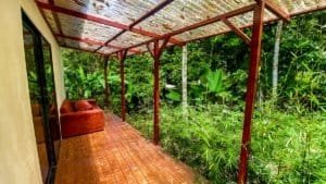 Fully renovated Costa Rican-style home with lush greenery and streams.