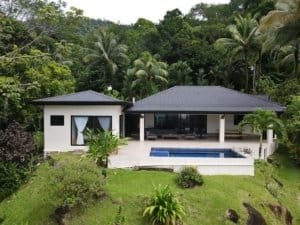 Modern home with pool and rainforest view in Dominical, Costa Rica.