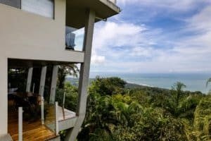 Contemporary jungle home overlooking lush greenery and ocean in Dominical.