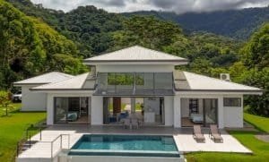 Modern Costa Rican luxury home with pool, ocean, and mountain views.