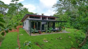 Modern house in lush green landscape in Dominical, Costa Rica.