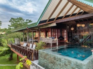 Luxury Costa Rica home with pool and ocean view, elevated above the canopy.