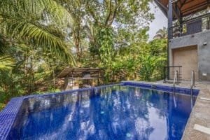 Luxury pool with lush tropical garden in Dominical Costa Rica.