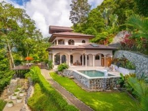 Elegant Mediterranean-style villa with pool, lush gardens, and ocean view in Dominical.