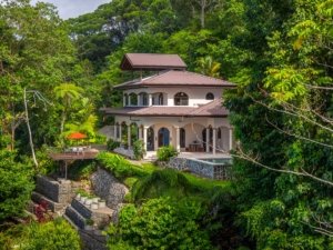 Luxury ocean view villa with lush tropical surroundings in Dominical, Costa Rica.