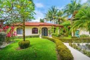 Beautiful tropical garden with modern house and lush greenery in Dominical.
