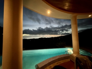 Elegant pool with ocean and mountain view in Dominical, Costa Rica.