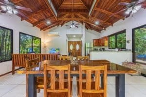 Spacious tropical villa with high wooden ceilings and large windows in Dominical.