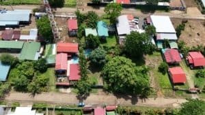 Aerial view of land parcels with homes and trees in Dominical, Costa Rica.